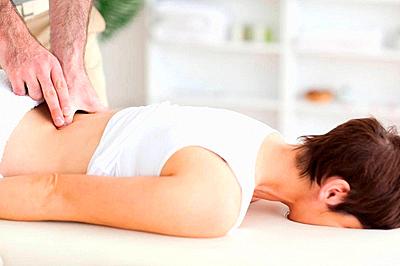 Chiropractor massaging a woman-stock-photo
