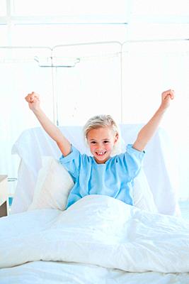 Happy child patient punching the air-stock-photo